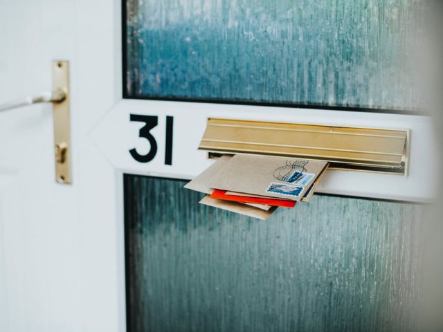 Image of mail sticking out of a mail slot